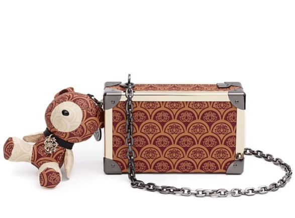 clutch-isla-trunk-sirena-monograma-canvas-caramelo-1