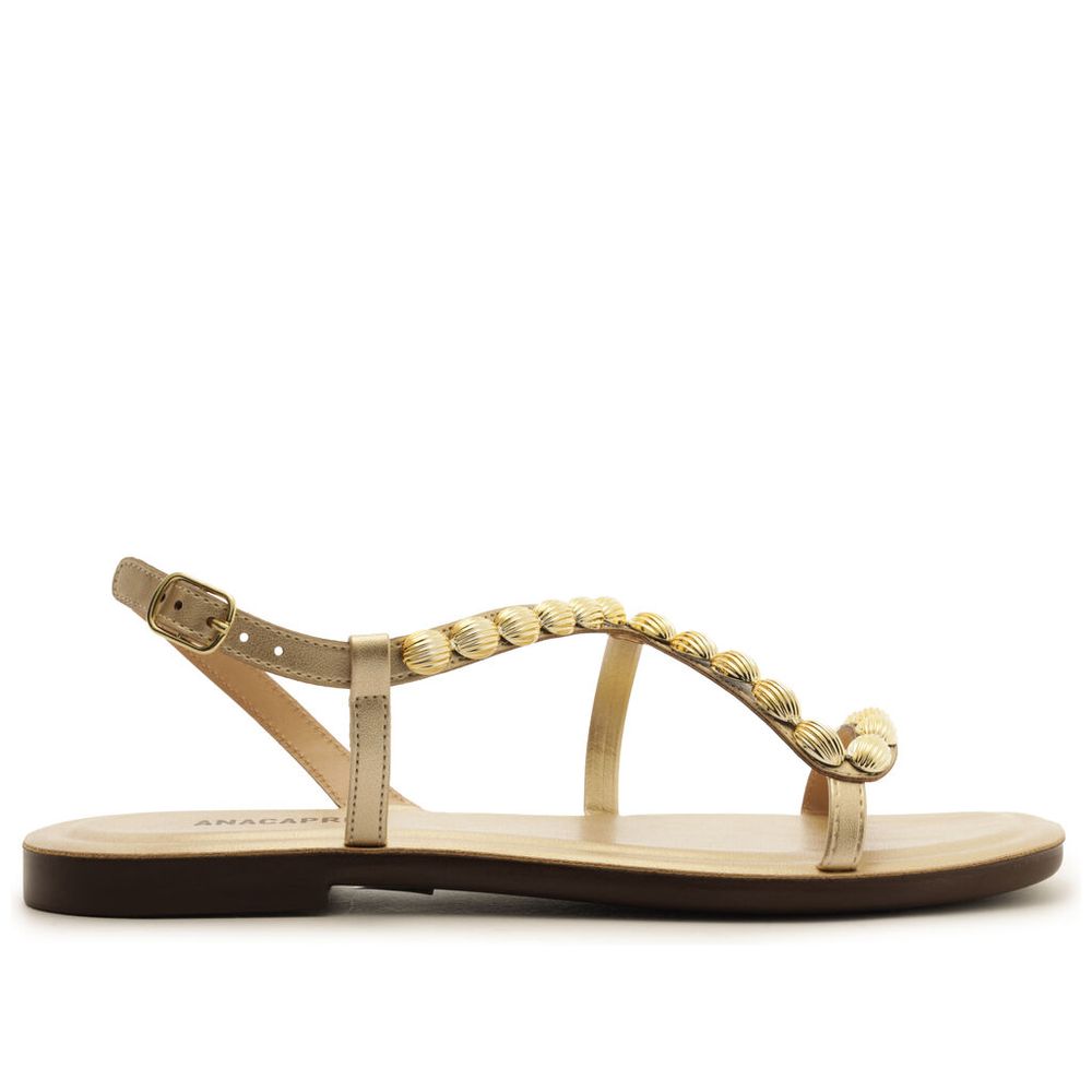 sandalia-anacapri-tira-curvada-metalizada-dourada-pedrarias-1